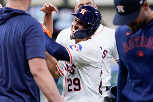 Urìas beats throw to 1st to help the Astros outlast the Orioles, 5-4 in 12 innings