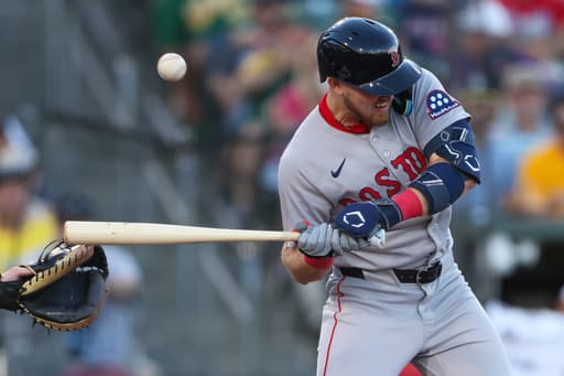 Curtis Mead leaves after being hit on the wrist by a pitch in 2nd at-bat with Red Sox