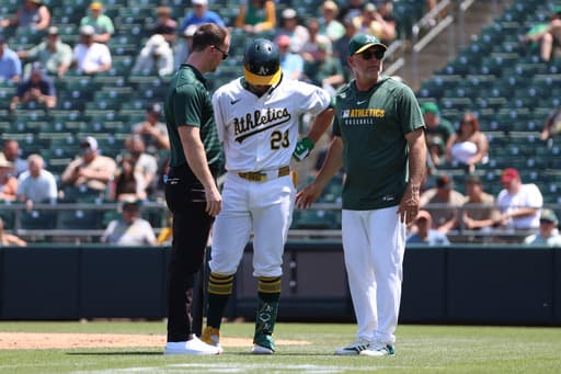 Athletics’ Shea Langeliers exits vs. Twins after grabbing left side while batting