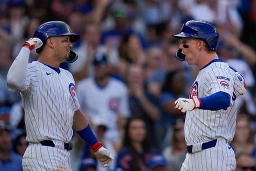 Cubs beat Cardinals 7-3 to clinch NL wild card spot