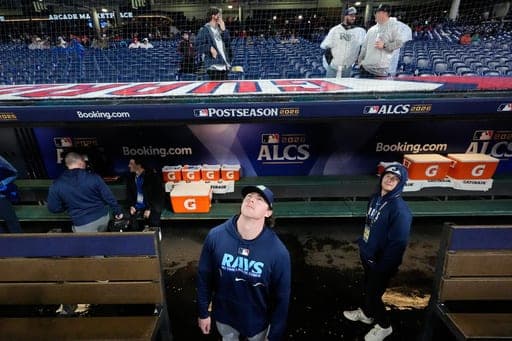 Tampa Bay Rays pitcher Slade Cecconi watches as Game 4 of an American League Championship Series baseball game postpone due to weather in Cleveland, Friday, Oct. 16, 2026. (AP Photo/David J. Phillip) (AP Photo/David J. Phillip)