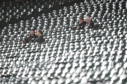 Chicago White Sox fans sit in seats after Game 4 of baseball's American League Division Series against the Cleveland Guardians, Thursday, Oct. 8, 2026, in Chicago. (AP Photo/Nam Huh) (AP Photo/Nam Huh)
