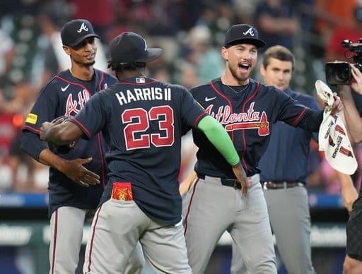 Atlanta Braves' Michael Harris II (23) and DaShawn Keirsey Jr., front right, celebrate on the field after a baseball game against the Houston Astros as they clinched the NL East title, Sunday, Sept. 20, 2026, in Houston. (AP Photo/Karen Warren) (AP Photo/Karen Warren)