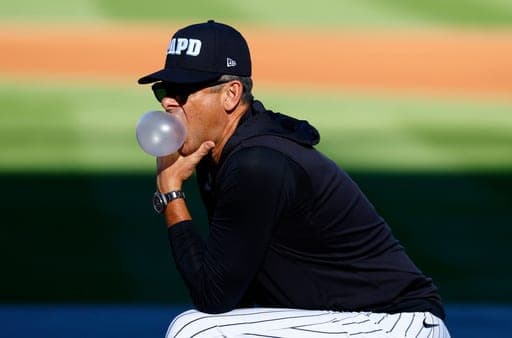 New York Yankees manager Aaron Boone blows a bubble during batting practice before a baseball game against the New York Mets, Friday, Sept. 11, 2026, in New York. (AP Photo/Noah K. Murray) (AP Photo/Noah K. Murray)