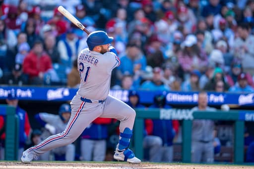 Rangers blow 3-run lead in 9th inning but recover to top Phillies 5-4 in the 10th