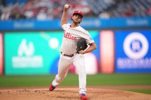 Phillies pitcher Aaron Nola throws to batters, ramping up return from ankle and rib injuries
