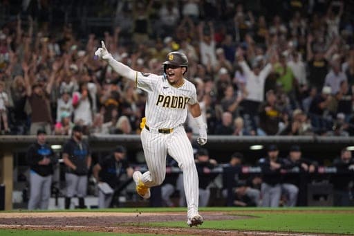 San Diego Padres' Ethan Salas celebrates after hitting a walk off single to defeat the Miami Marlins 7-6 during the tenth inning of a baseball game Saturday, Sept. 19, 2026, in San Diego. (AP Photo/Gregory Bull) (AP Photo/Gregory Bull)