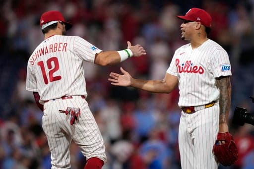 Philadelphia Phillies' Jhoan Duran, right, and Kyle Schwarber celebrate after the Phillies won a baseball game against the Houston Astros Wednesday, Sept. 9, 2026, in Philadelphia. (AP Photo/Matt Slocum) (AP Photo/Matt Slocum)