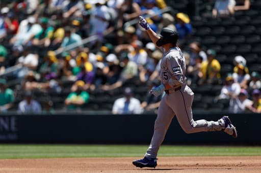 Rockies set club record for runs with 23-9 victory over A’s in Las Vegas heat
