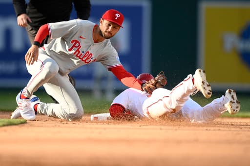 Trea Turner sits out with a back problem and JT Realmuto leaves with a bruised foot for the Phillies