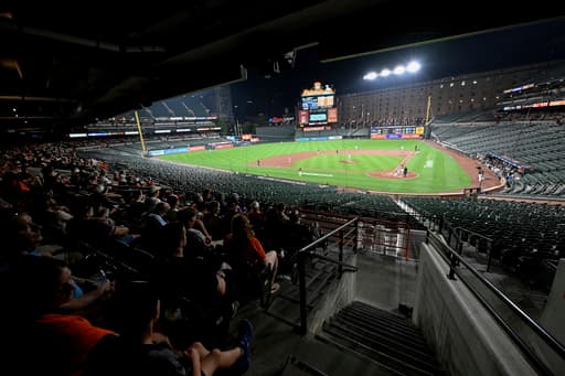 Why did the Orioles and Rockies keep playing after fans evacuated seats?
