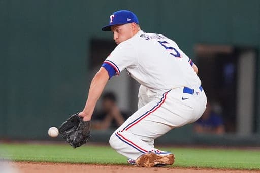 Texas Rangers shortstop Corey Seager fields a grounder during a baseball game against the New York Mets, Wednesday, Sept. 23, 2026, in Arlington, Texas. (AP Photo/LM Otero) (AP Photo/LM Otero)