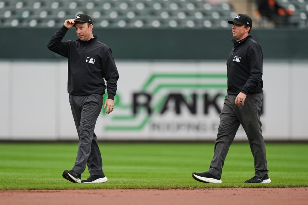 Twin brothers Austin and Tyler Jones ump a big league game together for the first time