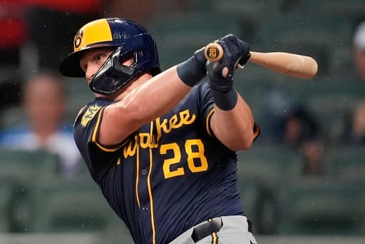 Peralta throws 5 strong innings as Brewers manhandle Braves 7-2 to improve best record in majors