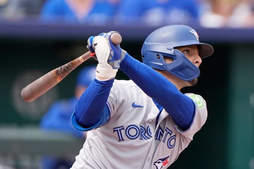 Blue Jays become first in AL to clinch playoff spot, beat Royals 8-5