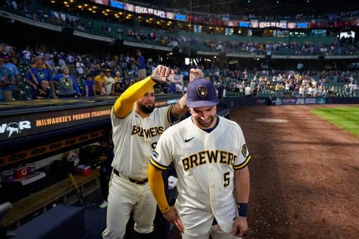 Milwaukee Brewers' Gary Sánchez, left, pours water on Garrett Mitchell (5) after winning a baseball game against the Seattle Mariners Thursday, Aug. 20, 2026, in Milwaukee. (AP Photo/Kayla Wolf) (AP Photo/Kayla Wolf)