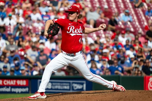 Surging Reds blank Cubs, move into tie for NL wild card spot