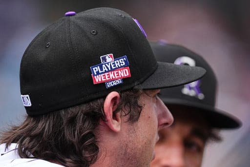 Colorado Rockies relief pitcher Nick Frasso wears a cap with a Players' Weekend patch in the eighth inning of a baseball game against the Cleveland Guardians, Sunday, Aug. 23, 2026, in Denver. (AP Photo/David Zalubowski) (AP Photo/David Zalubowski)