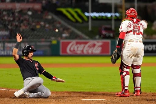 Cleveland Guardians' Steven Kwan, left, scores on a double by José Ramírez as Los Angeles Angels catcher Moisés Ballesteros gestures during the eighth inning of a baseball game Tuesday, Aug. 25, 2026, in Anaheim, Calif. (AP Photo/Mark J. Terrill) (AP Photo/Mark J. Terrill)