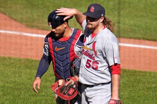 St. Louis Cardinals pitcher Ryne Stanek (55) and catcher Iván Herrera walk to the dugout following the eighth inning of a baseball game against the Pittsburgh Pirates in Pittsburgh, Thursday, Sept. 24, 2026. (AP Photo/Gene J. Puskar) (AP Photo/Gene J. Puskar)
