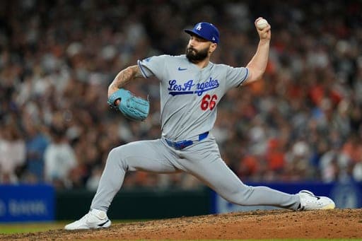 Los Angeles Dodgers pitcher Tanner Scott throws against the Detroit Tigers during the ninth inning of a baseball game Friday, Aug. 28, 2026, in Detroit. (AP Photo/Paul Sancya) (AP Photo/Paul Sancya)