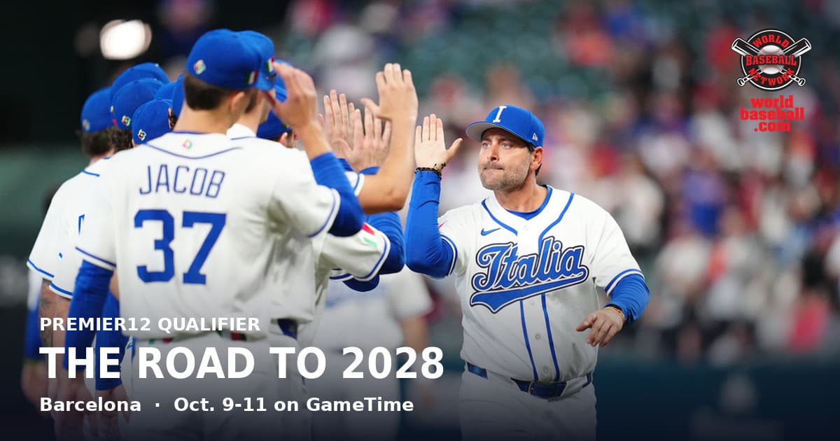 Italy manager Francisco Cervelli high-fives his players before a World Baseball Classic quarterfinal.