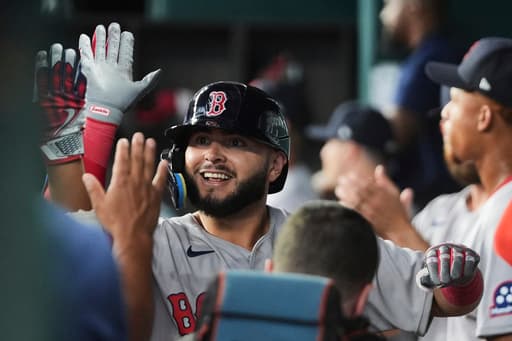 Abreu hits 3-run shot in 9th for his second homer in the opener to power Red Sox past Rangers 5-2