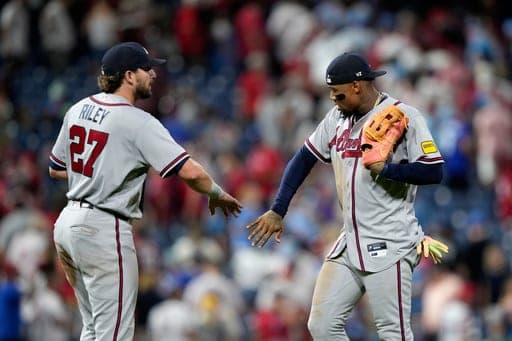 Atlanta Braves' Austin Riley, left, and Ronald Acuña Jr. celebrate after the Braves won a baseball game against the Philadelphia Phillies Friday, Sept. 4, 2026, in Philadelphia. (AP Photo/Matt Slocum) (AP Photo/Matt Slocum)