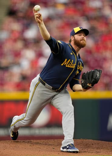 Woodruff’s stellar return and Ortiz’s sacrifice fly in 10th lift Brewers to 2-1 win over Reds