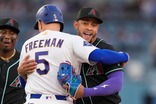 Dodgers’ Freddie Freeman gets tagged out with a hug after snapping 0-for-8 skid