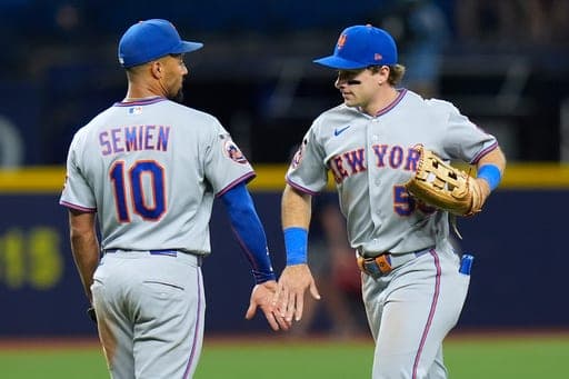 New York Mets' Nick Morabito (55) celebrates with second baseman Marcus Semien (10) after the team defeated the Tampa Bay Rays during a baseball game Wednesday, Sept. 2, 2026, in St. Petersburg, Fla. (AP Photo/Chris O'Meara) (AP Photo/Chris O'Meara)