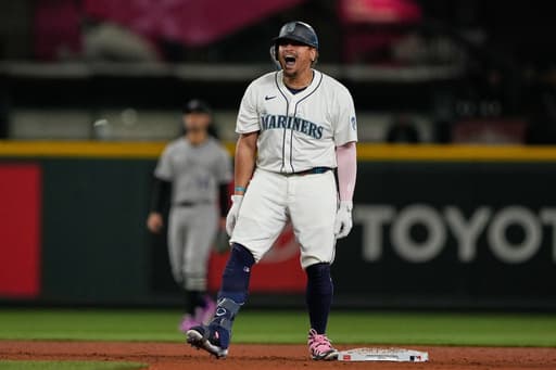 Mariners clinch playoff berth, beating Rockies 4-3 on Josh Naylor’s bases-clearing double