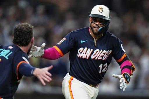 San Diego Padres' Luis Campusano celebrates with teammates after hitting a two-run, walk off home run during the tenth inning of a baseball game against the New York Yankees Friday, Sept. 4, 2026, in San Diego. (AP Photo/Gregory Bull) (AP Photo/Gregory Bull)
