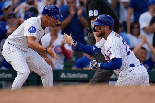 Busch stars as the Cubs beat the Cardinals 7-3 to clinch the top NL wild card