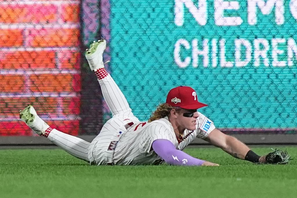Philadelphia Phillies center fielder Harrison Bader catches a pop-foul out by Los Angeles Dodgers' Andy Pages during the fifth inning in Game 1 of baseball's National League Division Series, Saturday, Oct. 4, 2025, in Philadelphia.