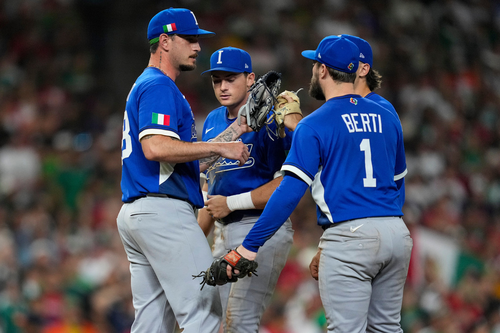Italy pitcher Claudio Scotti leaves the game against Mexico at the World Baseball Classic.