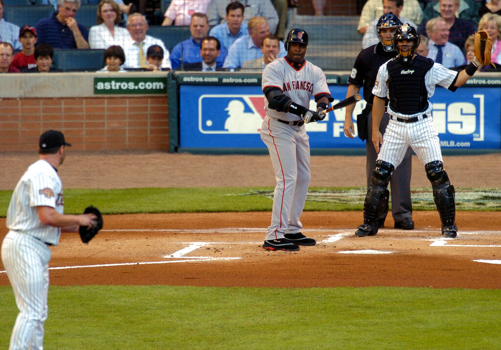 Title: GIANTS ASTROS Image ID: 04040706143 Article: Houston Astros catcher is Brad Ausmus, right, signals for an intentional walk from pitcher Roger Clemens, left, against San Francisco's Barry Bonds during the first inning in Houston, Wednesday, April 7, 2004. (AP Photo/Brett Coomer)