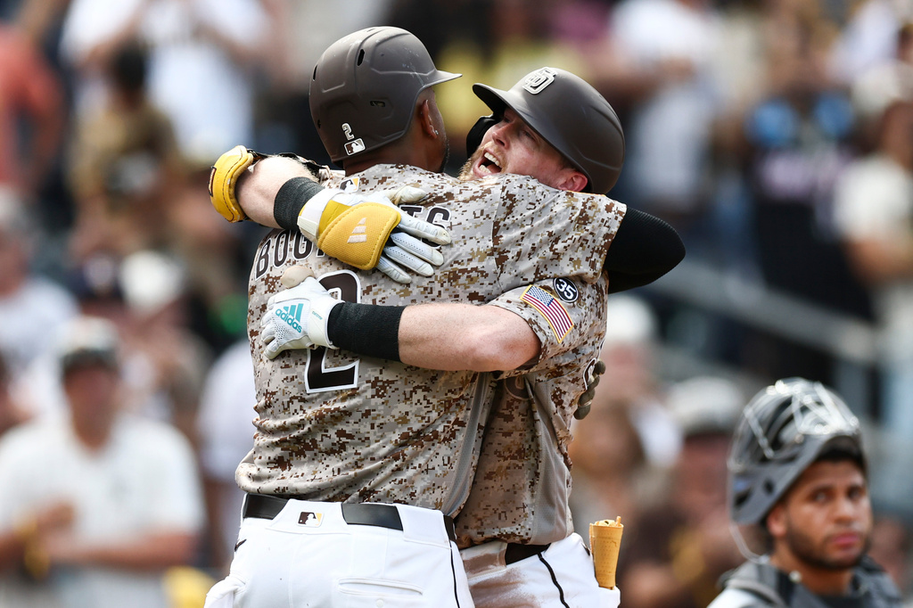 Padres infielder Jake Cronenworth celebrates a home run with Xander Bogaerts.
