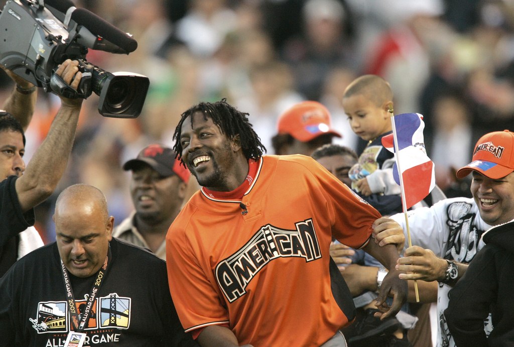 Vladimir Guerrero Sr. celebrates winning the 2007 All-Star Home Run Derby; in 2023 son Vladimir Jr. won the same event.