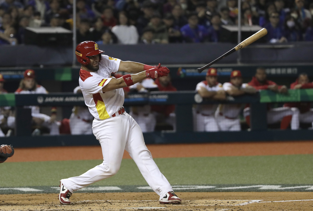 Spain catcher Gabriel Lino bats during a World Baseball Classic qualifying game against Taiwan.