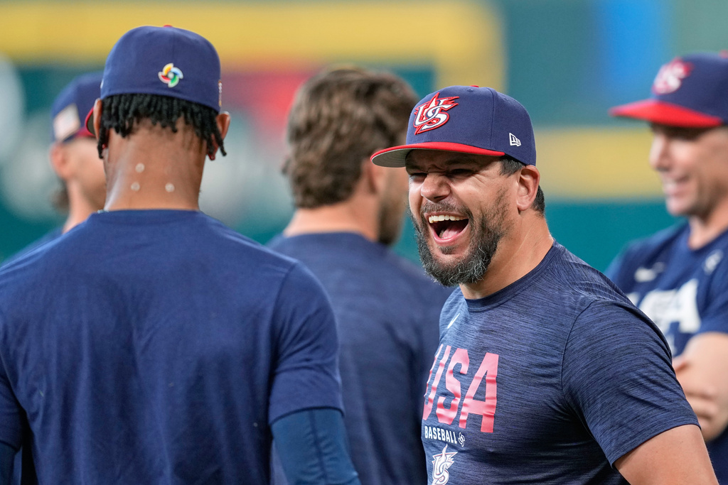 Kyle Schwarber laughs with Byron Buxton during a Team USA workout at the World Baseball Classic.