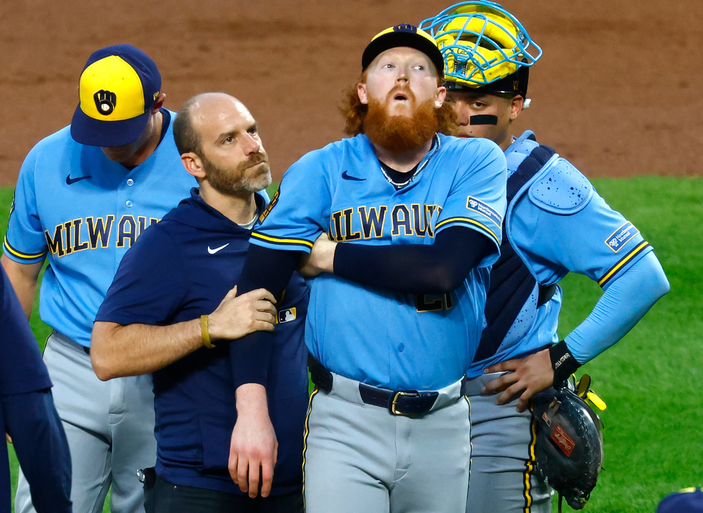 Brewers pitcher Dustin May reacts after being hit by a batted ball against the Mets.