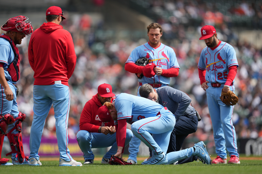 Dustin May is checked by trainers after being struck by a ground ball in April.