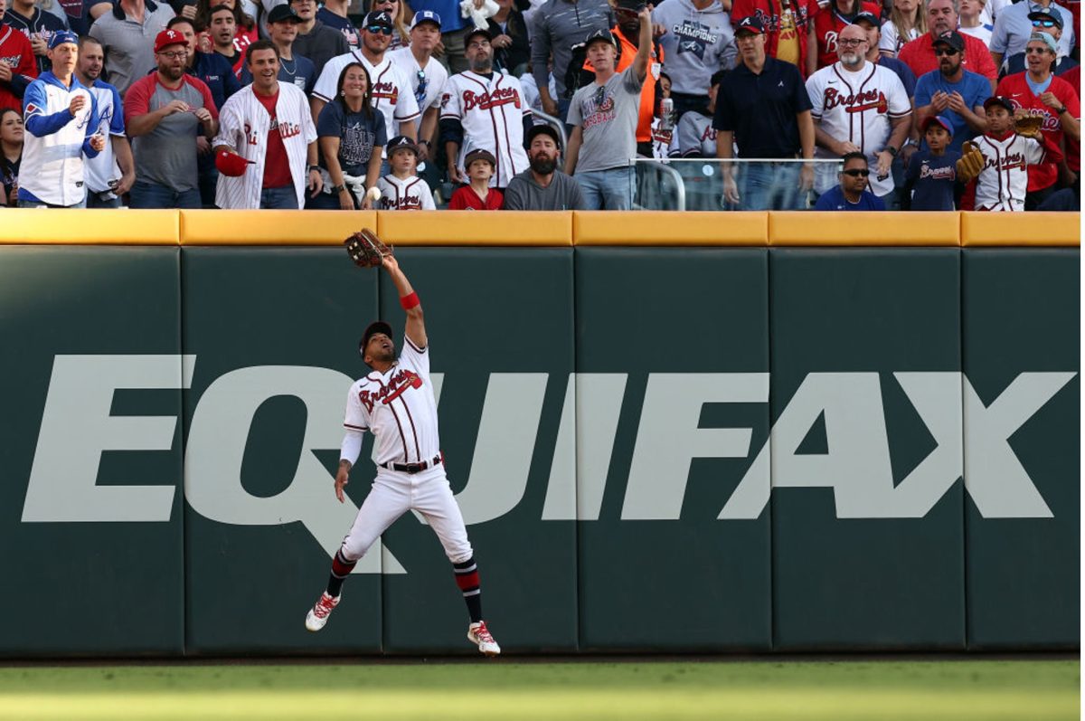 Eddie Rosario of the Atlanta Braves catches a ball in the first inning against the Philadelphia Phillies during Game Two of the Division Series at Truist Park on October 09, 2023 in Atlanta, Georgia. (Photo by Elsa/Getty Images)