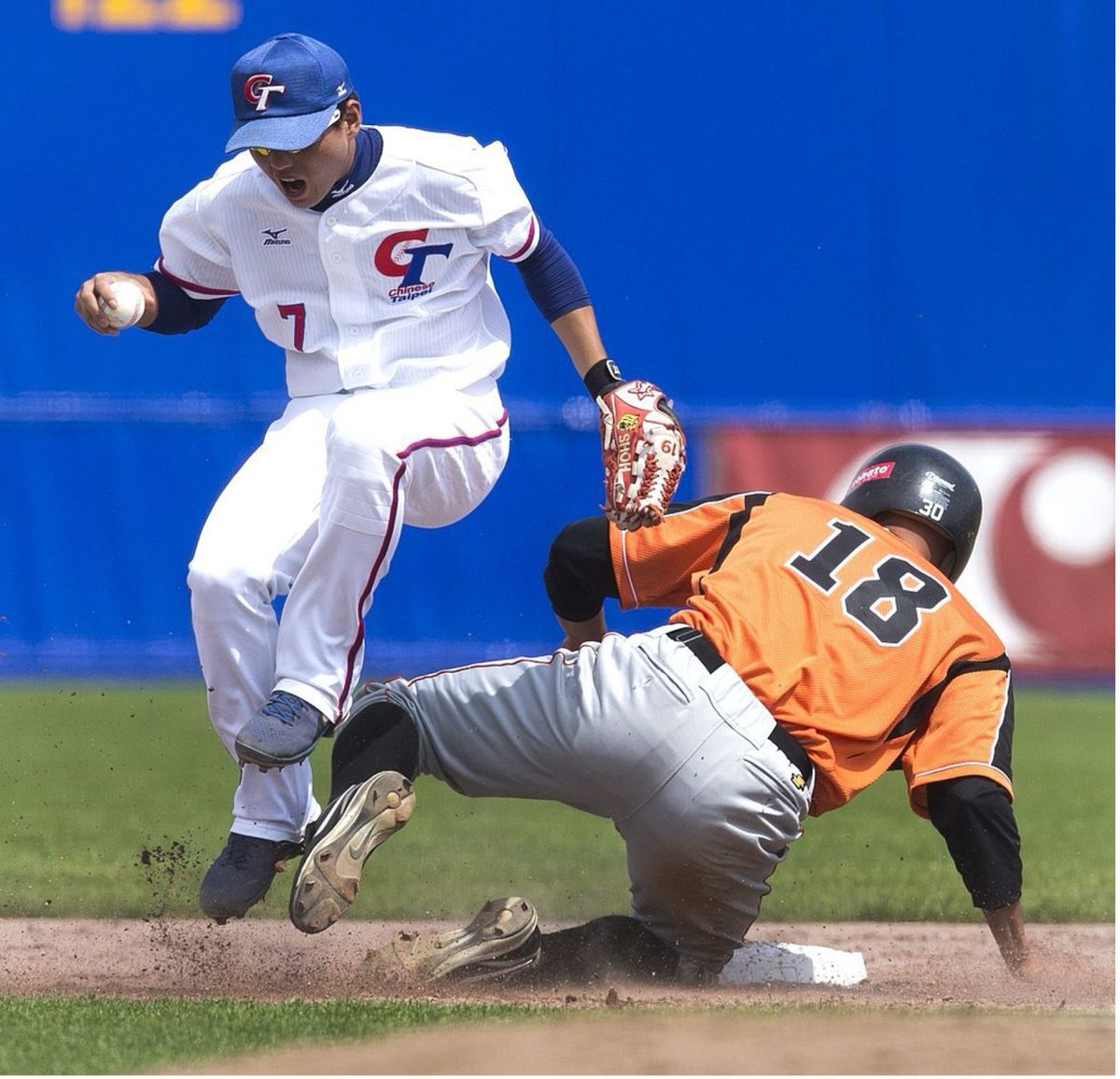 Gilmer Lampe of The Netherlands is out on second base in the group match between The Netherlands and Taiwan during the baseball Haarlem Honkbal Week in Haarlem, The Netherlands on 13 July. On the right Hsiao Po Ting of Taiwan. AFP PHOTO / ANP / KOEN SUYK netherlands out (Credit: KOEN SUYK/AFP via Getty Images)