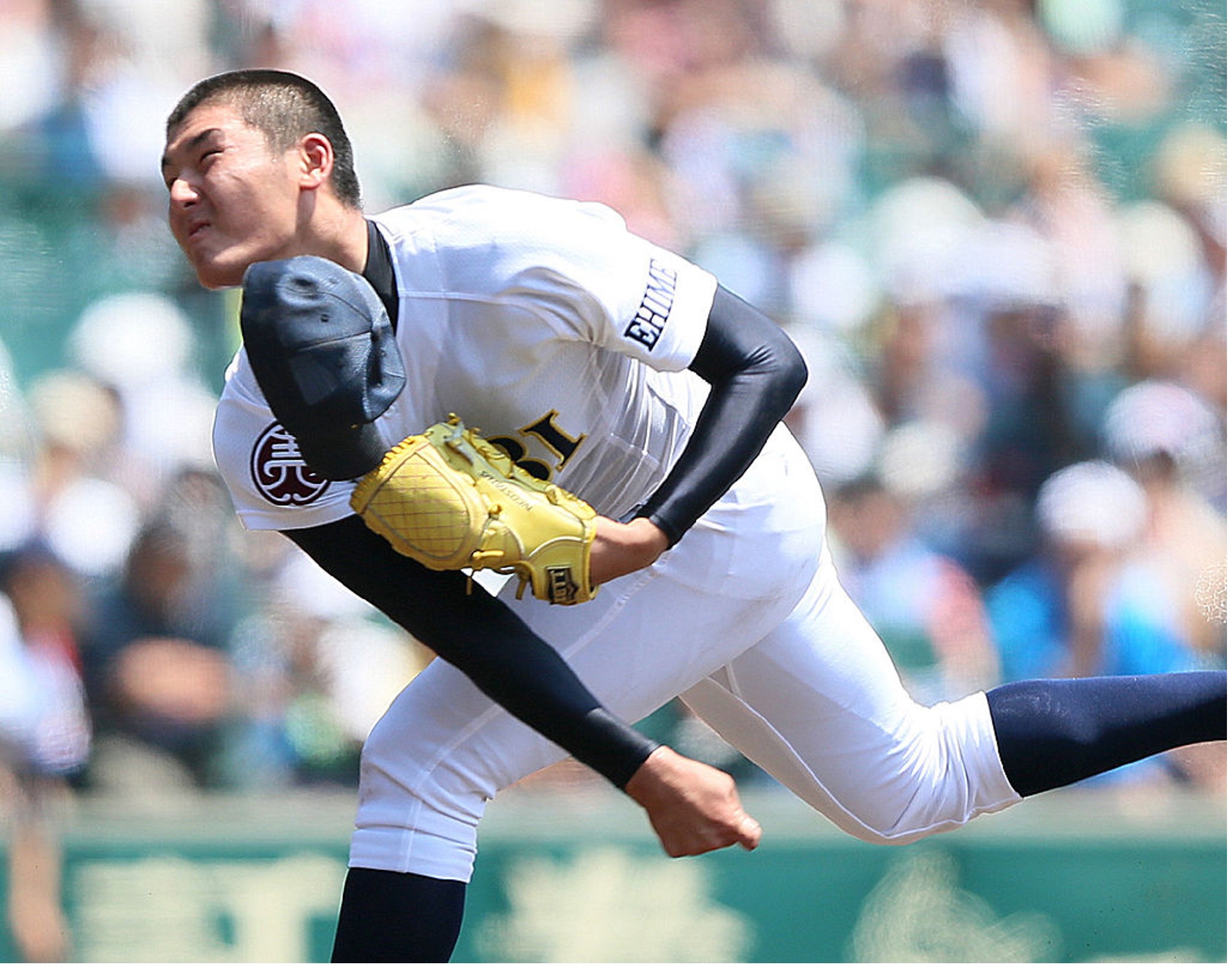 Starting pitcher Tomohiro Anraku of Saibi High School throws during the second round game against Mie High School in the National High School Baseball Championships at Koshien Stadium in Nishinomiya, western Japan, on August 14, 2013. (Photo credit: JIJI PRESS/AFP via Getty Images)