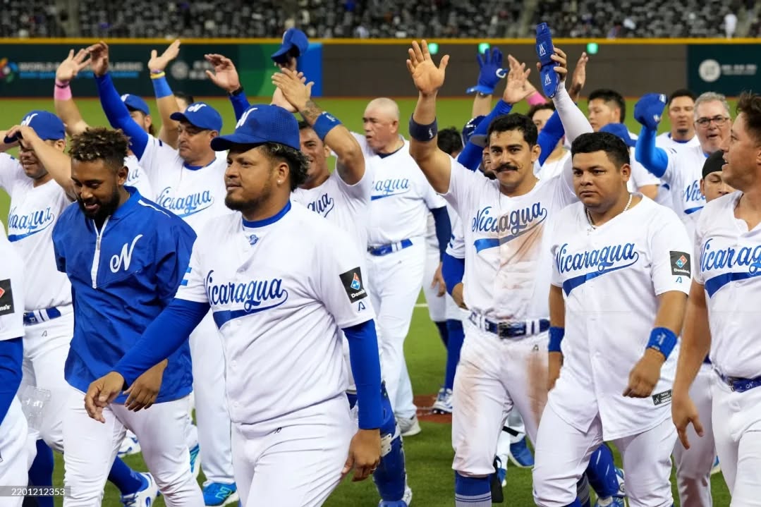 Nicaraguan baseball players erupt in celebration after a dramatic 10th-inning walk‑off win at the 2025 World Baseball Classic Qualifiers.