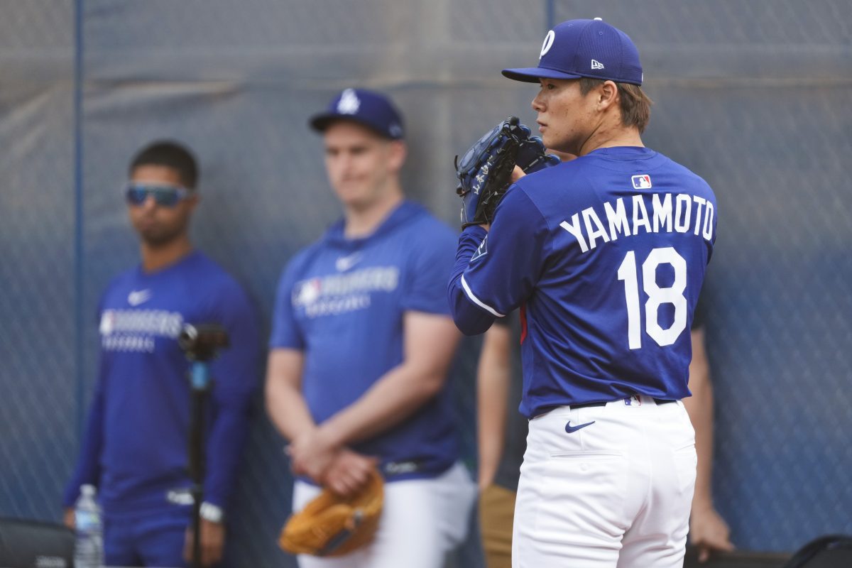 Los Angeles Dodgers pitcher Yoshinobu Yamamoto throws in the bullpen during spring training baseball practice on Feb. 17, 2025, in Phoenix, Arizona.