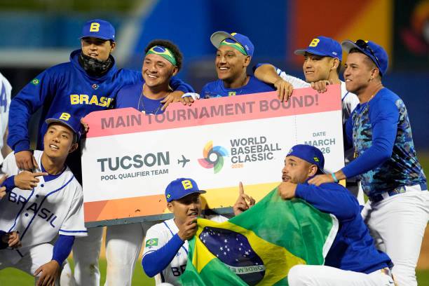 Brazil’s team celebrates on the field after defeating Germany 6-4 to clinch the final spot in the 2026 World Baseball Classic in Tucson, Arizona.