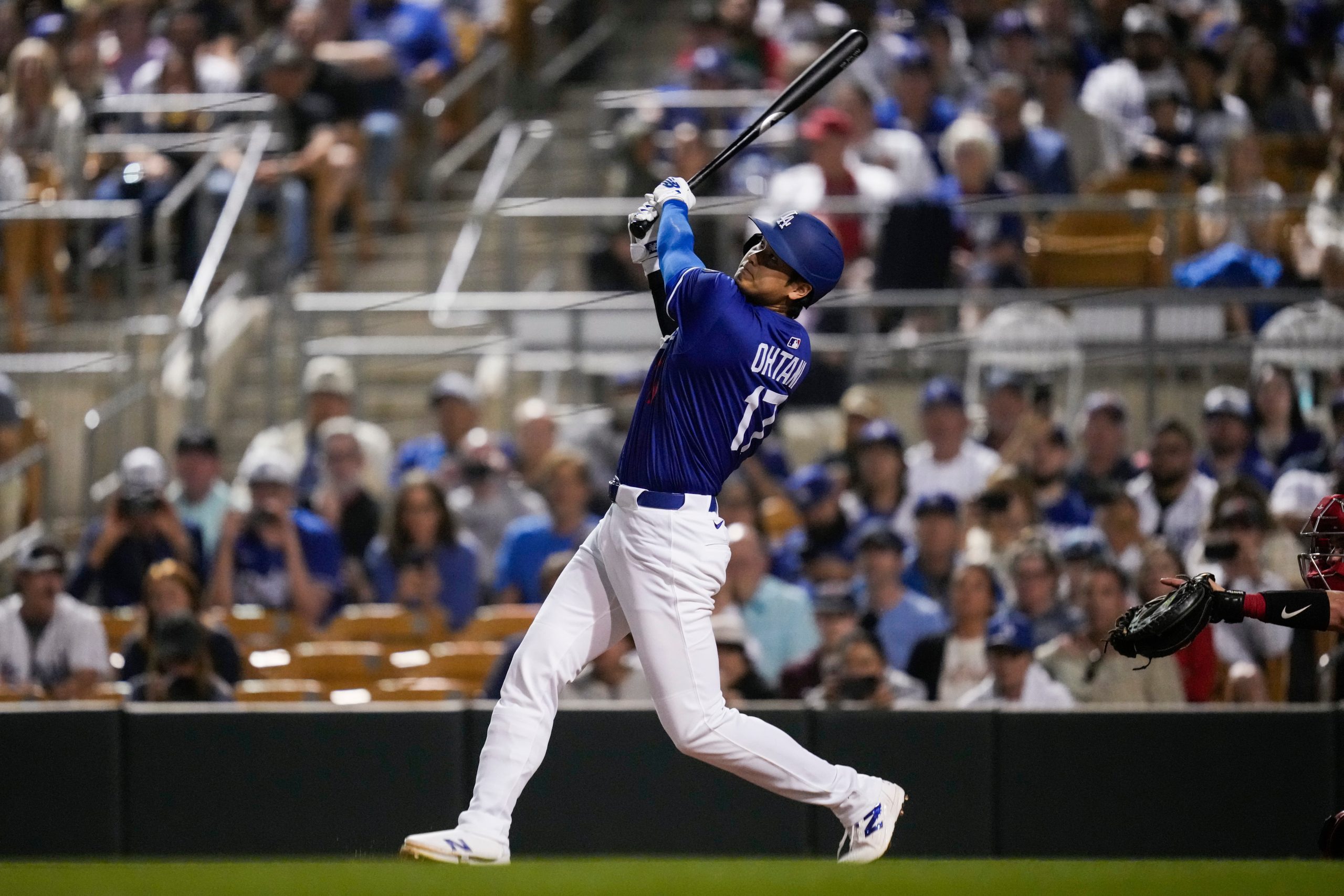 Los Angeles Dodgers designated hitter Shohei Ohtani pops out to shortstop during the second inning of a spring training game against the Angels on Feb. 28, 2025, following his first inning homers in his 2024 and 2025 debut